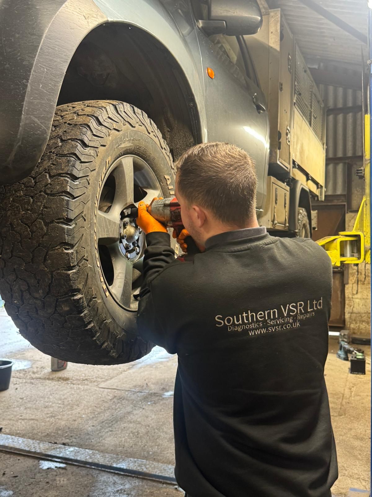Southern VSR technician fitting a tyre with an impact gun in the workshop