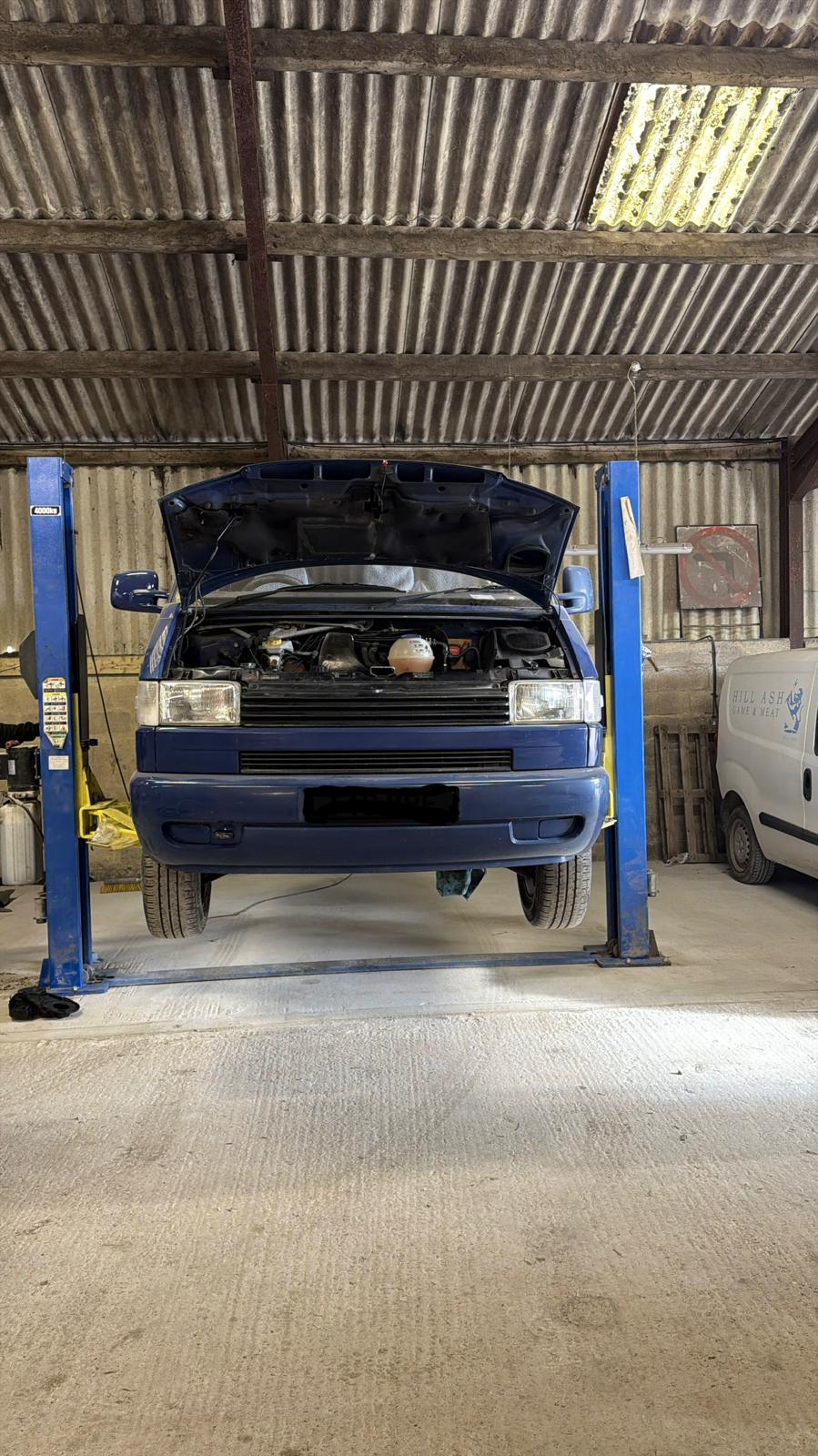 VW T4 campervan raised on the two-post lift at Southern VSR